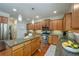 Bright kitchen with stainless steel appliances, granite countertops, and a large island at 8220 Majors Ridge Way, Cumming, GA 30041