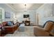 Comfortable living room with neutral colors, stylish furniture, and ample natural light at 8220 Majors Ridge Way, Cumming, GA 30041