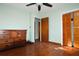 Bedroom featuring hardwood floors, light walls, closet, and a ceiling fan at 1879 Mural Cir, Morrow, GA 30260