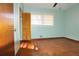 Bedroom featuring hardwood floors, light walls, and window at 1879 Mural Cir, Morrow, GA 30260