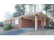 Brick carport showcasing the side exterior features at 1879 Mural Cir, Morrow, GA 30260