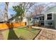 Picturesque backyard featuring a dining set, grill, and green lawn, ideal for relaxing and entertaining outdoors at 306 Nelms Ne Ave, Atlanta, GA 30307