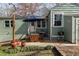 Cozy backyard area with patio, grill, string lights, and lush greenery, perfect for relaxing and entertaining outdoors at 306 Nelms Ne Ave, Atlanta, GA 30307