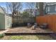 Backyard gravel area with comfortable seating, ideal for cozy gatherings around the fire pit at 306 Nelms Ne Ave, Atlanta, GA 30307