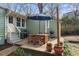 Charming backyard featuring a dining set, grill, string lights, and outdoor space perfect for entertaining at 306 Nelms Ne Ave, Atlanta, GA 30307