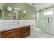 Modern bathroom with a sleek vanity, new toilet and a frameless glass shower at 306 Nelms Ne Ave, Atlanta, GA 30307