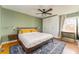 Comfortable bedroom with hardwood floors, ceiling fan, and ample closet space at 306 Nelms Ne Ave, Atlanta, GA 30307