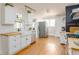 Well-lit kitchen with stainless steel appliances, wood countertops, and white cabinets at 306 Nelms Ne Ave, Atlanta, GA 30307