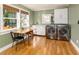 A modern laundry room with stainless steel washer and dryer and natural light at 306 Nelms Ne Ave, Atlanta, GA 30307