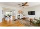 Cozy living room with hardwood floors, ceiling fan and a view of the dining area at 306 Nelms Ne Ave, Atlanta, GA 30307