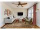 Bright and airy living room featuring hardwood floors, ceiling fan, and modern decor at 306 Nelms Ne Ave, Atlanta, GA 30307