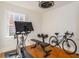 Home gym featuring exercise bike, weights, weight bench, and hardwood floors at 306 Nelms Ne Ave, Atlanta, GA 30307