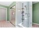 Bathroom showcases a modern glass-enclosed shower and mirrored closet at 565 Ashvale Overlook, Alpharetta, GA 30005