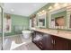 Luxurious bathroom with freestanding tub, double vanity, and natural light at 565 Ashvale Overlook, Alpharetta, GA 30005