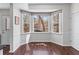 Bright breakfast nook with large windows offering natural light and serene views at 565 Ashvale Overlook, Alpharetta, GA 30005