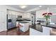 Modern kitchen featuring stainless steel appliances, granite countertops, and a center island at 565 Ashvale Overlook, Alpharetta, GA 30005