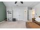 Spacious living room area with a ceiling fan, featuring neutral walls and access to other rooms at 565 Ashvale Overlook, Alpharetta, GA 30005