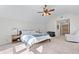 Spacious main bedroom with vaulted ceiling, natural light, and cozy sitting area at 565 Ashvale Overlook, Alpharetta, GA 30005