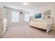 Bright bedroom featuring neutral walls, carpet flooring, and ample natural light from two large windows at 783 Phil Haven Ln, Kennesaw, GA 30152