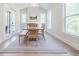 Charming dining area with a wood table and bench seating, bright windows at 783 Phil Haven Ln, Kennesaw, GA 30152