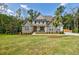 Beautiful two-story home with stone and shake siding and a lush green lawn at 783 Phil Haven Ln, Kennesaw, GA 30152