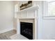 Elegant fireplace with white mantel and marble surround in a cozy room at 783 Phil Haven Ln, Kennesaw, GA 30152