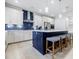 Stylish kitchen island featuring modern stools and contrasting cabinetry at 783 Phil Haven Ln, Kennesaw, GA 30152