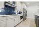 Gourmet kitchen with sleek appliances and white cabinets at 783 Phil Haven Ln, Kennesaw, GA 30152