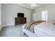 A spacious main bedroom featuring a large TV on a wooden console at 783 Phil Haven Ln, Kennesaw, GA 30152