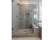 Modern tile shower with glass door and built in bench seating at 783 Phil Haven Ln, Kennesaw, GA 30152