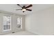 Bedroom featuring two large windows and a ceiling fan at 1004 Masons Creek Cir # 1004, Atlanta, GA 30350