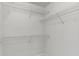 Walk-in closet with white walls and metal shelves at 1004 Masons Creek Cir # 1004, Atlanta, GA 30350