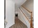 Inviting entryway featuring wood-look floors, stairs to upper level, and adjacent living space at 1004 Masons Creek Cir # 1004, Atlanta, GA 30350
