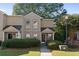 Charming townhome featuring a well-maintained lawn, classic design, and inviting entrance at 1004 Masons Creek Cir # 1004, Atlanta, GA 30350