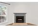 Close-up of the charming fireplace, with its gray mantle, creating a cozy focal point at 1004 Masons Creek Cir # 1004, Atlanta, GA 30350
