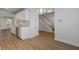 Open-concept view of the kitchen with wood floors and stainless steel appliances at 1004 Masons Creek Cir # 1004, Atlanta, GA 30350