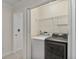 Laundry closet with a full size washer and dryer and wire shelf at 1004 Masons Creek Cir # 1004, Atlanta, GA 30350