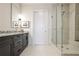 Stylish bathroom features a glass shower, sleek vanity with gray marble countertop, and modern fixtures at 1065 Peachtree Ne St # 3005, Atlanta, GA 30309