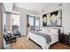 Bright bedroom with large windows and a stunning city view at 1065 Peachtree Ne St # 3005, Atlanta, GA 30309