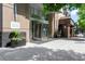 Modern building entrance featuring a revolving door and well-maintained landscaping at 1065 Peachtree Ne St # 3005, Atlanta, GA 30309