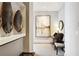 Elegant hallway with decorative art, desk, and seating at 1065 Peachtree Ne St # 3005, Atlanta, GA 30309