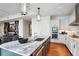 Spacious kitchen with white cabinets, marble countertops, and stainless steel appliances at 1065 Peachtree Ne St # 3005, Atlanta, GA 30309