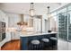 Modern kitchen with marble countertops, stainless steel appliances, and island seating at 1065 Peachtree Ne St # 3005, Atlanta, GA 30309