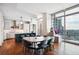 Dining area and kitchen featuring floor-to-ceiling windows with great views and modern lighting at 1065 Peachtree Ne St # 3005, Atlanta, GA 30309