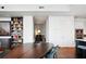 Open concept living area with a large wooden table and a bookcase filled with books at 1065 Peachtree Ne St # 3005, Atlanta, GA 30309
