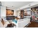 Inviting living room with bookshelves, modern furniture, and bright lighting at 1065 Peachtree Ne St # 3005, Atlanta, GA 30309