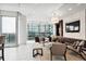 Bright lounge with large windows, seating, and a television at 1065 Peachtree Ne St # 3005, Atlanta, GA 30309