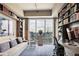 Office space with bookshelves, a desk, and city views at 1065 Peachtree Ne St # 3005, Atlanta, GA 30309