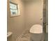 Modern bathroom featuring a freestanding tub, marble floors, and elegant fixtures at 1140 Smith Sw St, Atlanta, GA 30310