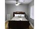 A cozy bedroom featuring hardwood floors and natural light from large windows at 1140 Smith Sw St, Atlanta, GA 30310